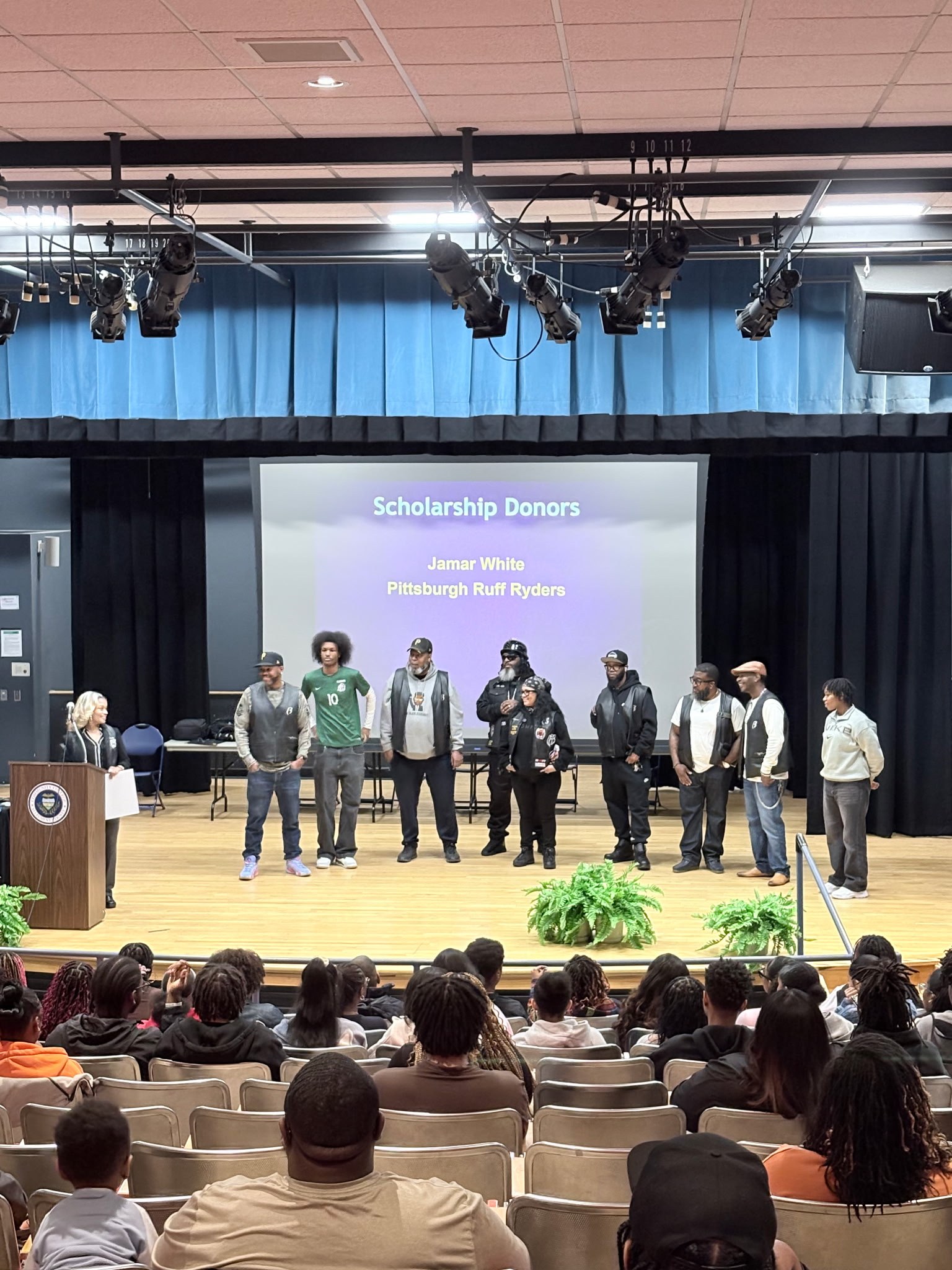 Pittsburgh Ruff Ryders on stage at scholarship ceremony wide view