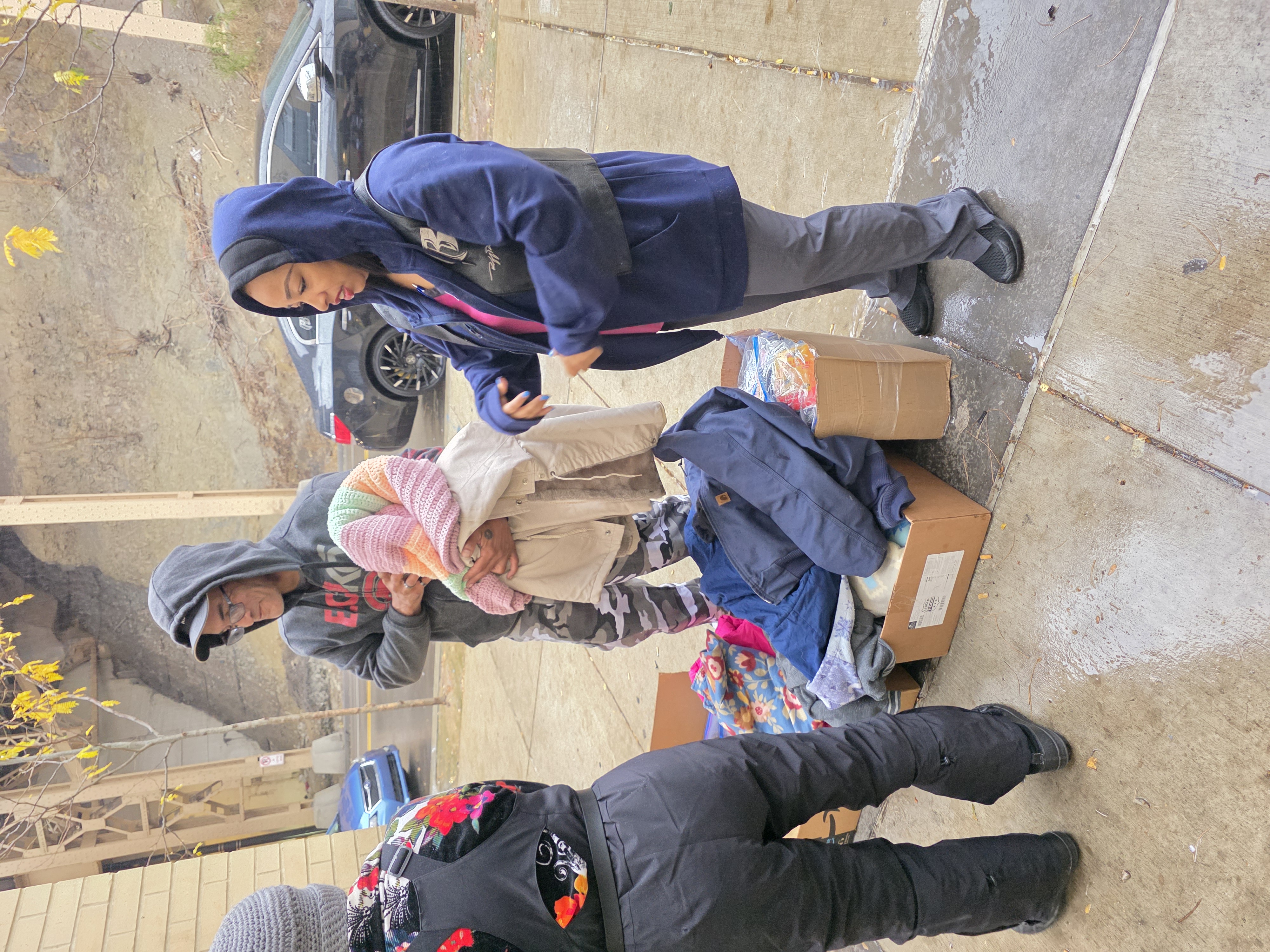 Ruff Ryders team handing out winter clothing to community members
