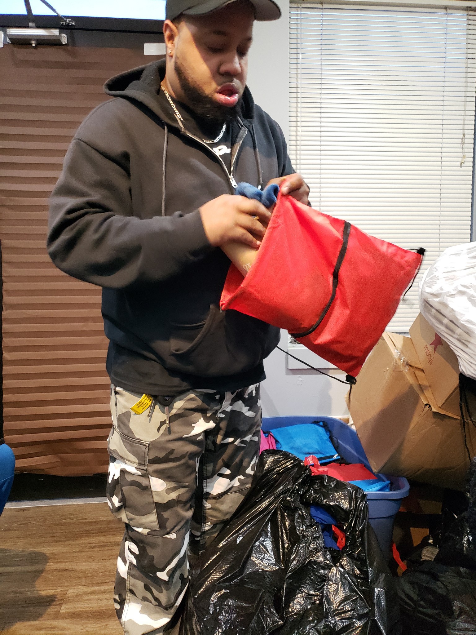 Volunteer packing supply bags for community outreach